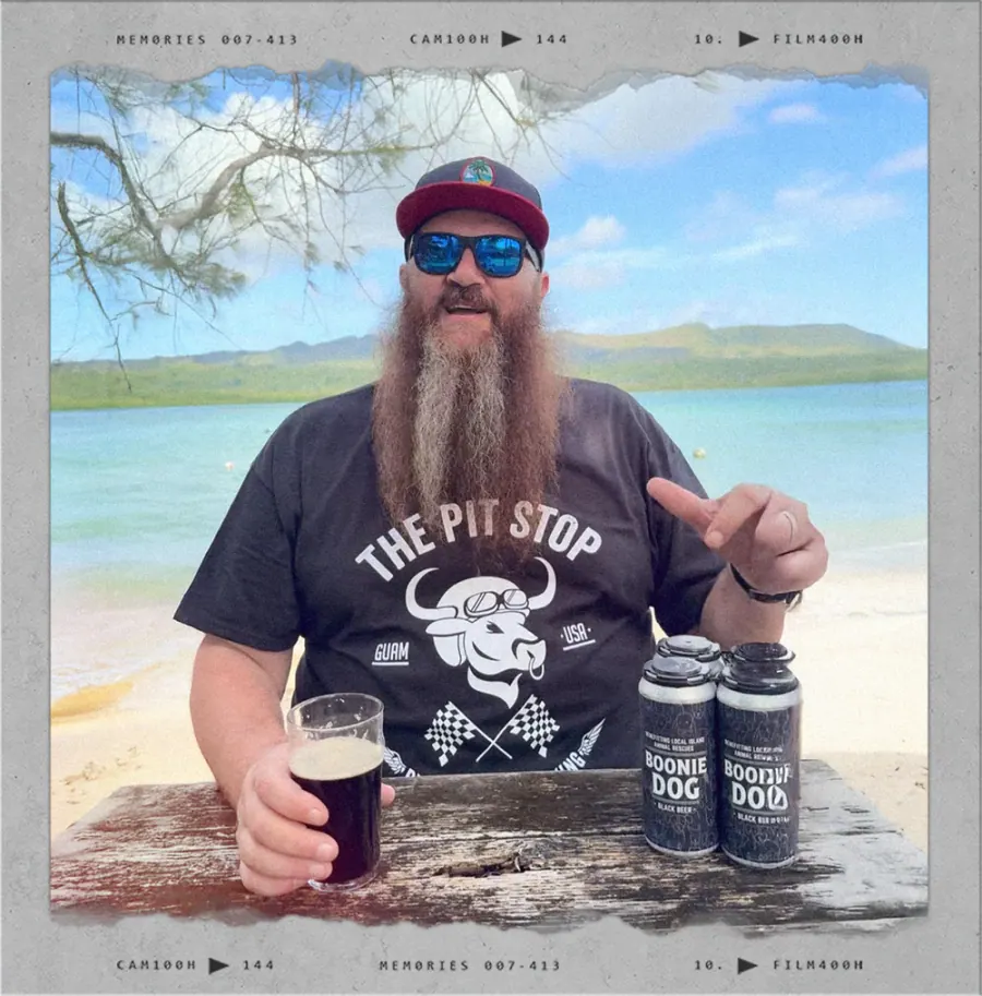 Ben Johnson holding a pint of Carabao beer